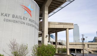 The Kay Bailey Hutchison Convention Center stands in Dallas on March 29, 2020. The U.S. government wants to house up to 3,000 immigrant teenagers at the center as it struggles to find space for a surge of migrant children who have inundated the border and strained the immigration system just two months into the Biden administration. (Juan Figueroa/The Dallas Morning News via AP)