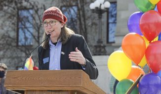 House Minority Leader Rep. Kim Abbott, D-Helena, speaks at the Rainbow Rally on the steps of the Montana State Capitol on Monday, March 15, 2021, in Helena, Mont. (Thom Bridge/Independent Record via AP)