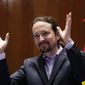FILE - In this Jan. 13, 2020 file photo, Podemos leader Pablo Iglesias gestures after receiving his ministerial briefcase in Madrid, Spain. The leader of the junior party in Spain&#39;s coalition government said on Monday March 15, 2021 he is leaving the Cabinet to run for regional office. Pablo Iglesias took the left-wing Juntos Podemos (United We Can) party into government 15 months ago with the Socialist party to take his place as deputy prime minister in charge of social rights. (AP Photo/Manu Fernandez, File)