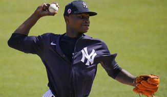 New York Yankees pitcher Domingo German delivers during the first inning of the team&#39;s spring training baseball game against the Detroit Tigers in Tampa, Fla., Friday, March 5, 2021. (AP Photo/Gene J. Puskar)