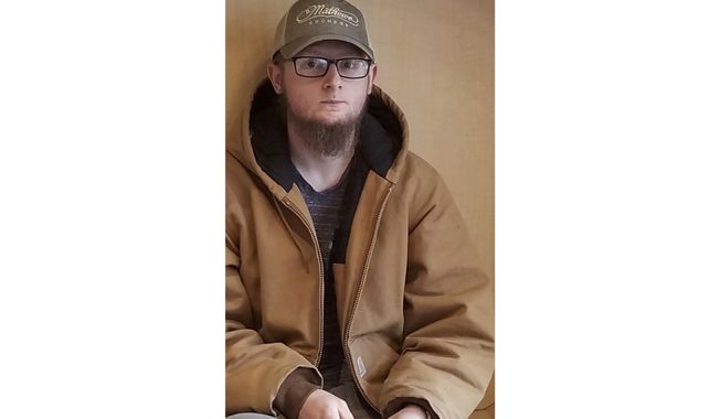 This undated photo provided by the Cherokee County Sheriff&#x27;s Office, in Georgia, shows Robert Aaron Long, of Woodstock, Ga. After a manhunt late Tuesday, March 16, 2021, authorities took Long into custody in connection with several fatal shootings at massage parlors in the Atlanta area. (Courtesy of Cherokee County Sheriff&#x27;s Office via AP)