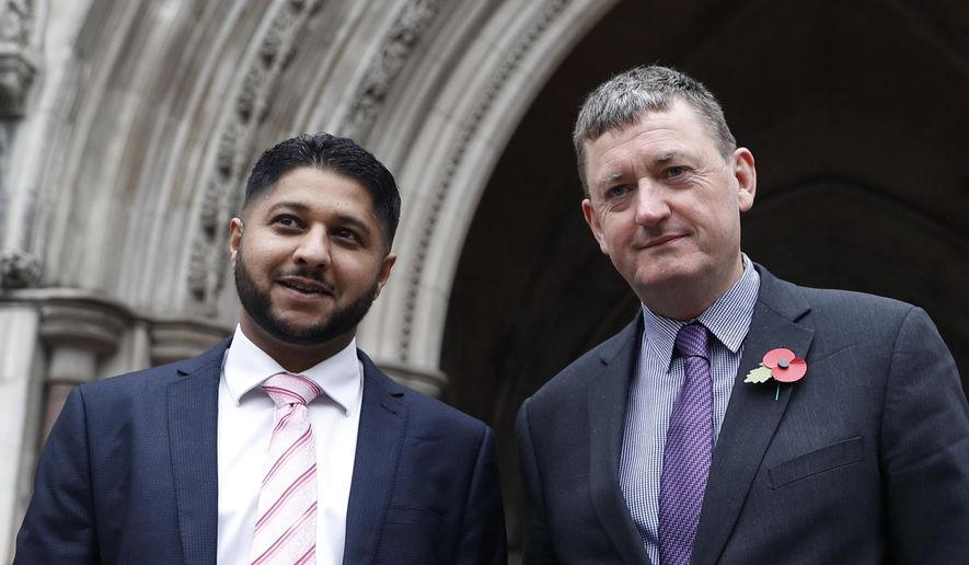 FILE- In this Oct. 30, 2018, file photo, former Uber drivers Yaseen Aslam, left, and James Farrar pose for the media outside the Royal Courts of Justice ahead of a legal hearing over employment rights in London. Uber is giving its U.K. drivers the minimum wage, pensions and holiday pay, following a recent court ruling that said they should be classified as workers and entitled to such benefits, the company announced Tuesday, March 16, 2021.  Farrar and Aslam of the App Drivers And Couriers Union said in a statement, the changes stopped short of the Supreme Court&#39;s ruling that pay should be calculated from when drivers log on to the app until they log off. And they said the company can&#39;t decide by itself the expense base for calculating the minimum wage, which should be based on a collective agreement.  (AP Photo/Alastair Grant, File)