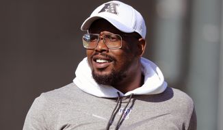 FILE - In this Jan. 22, 2020, file photo, AFC linebacker Von Miller, of the Denver Broncos ,smiles during NFL football practice at the Pro Bowl in Kissimmee, Fla. Prosecutors said Friday, March 5, 2021, that Broncos star linebacker Von Miller won&#39;t face criminal charges following an investigation by police in a Denver suburb. (AP Photo/Gregory Payan, File)