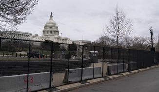 An inner perimeter anti-scaling fence is around the U.S. Capitol, Tuesday, March 16, 2021, in Washington. (AP Photo/Alex Brandon)