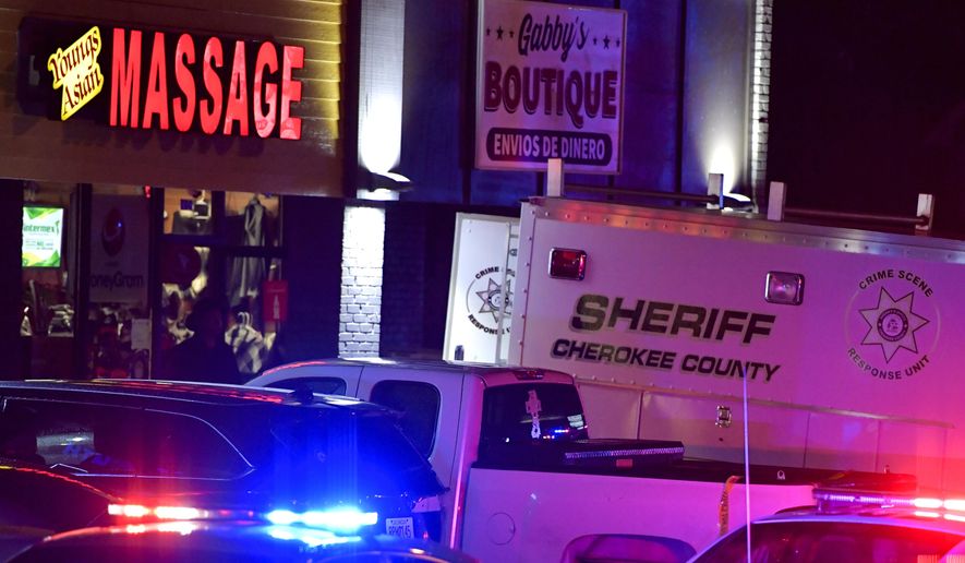 Authorities investigate a fatal shooting at a massage parlor, late Tuesday, March 16, 2021, in Acworth, Ga. Officials say 21-year-old Robert Aaron Long, of Woodstock, Georgia, has been captured hours after multiple people were killed in shootings at three Atlanta-area massage parlors. (AP Photo/Mike Stewart) **FILE**