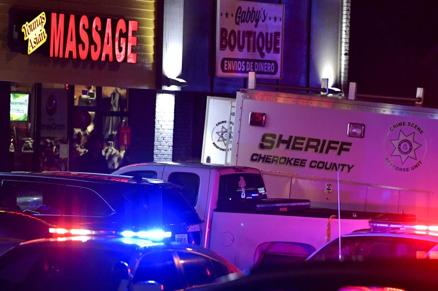 Authorities investigate a fatal shooting at a massage parlor, late Tuesday, March 16, 2021, in Acworth, Ga. Officials say 21-year-old Robert Aaron Long, of Woodstock, Georgia, has been captured hours after multiple people were killed in shootings at three Atlanta-area massage parlors. (AP Photo/Mike Stewart) **FILE**