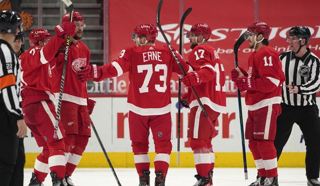 Detroit Red Wings left wing Adam Erne (73) celebrates his goal against the Carolina Hurricanes in the first period of an NHL hockey game Tuesday, March 16, 2021, in Detroit. (AP Photo/Paul Sancya)