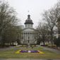 The South Carolina Statehouse and a flower bed designed as the state logo is seen on Tuesday, March 16, 2021, in Columbia, South Carolina. . (AP Photo/Jeffrey Collins)  **FILE**