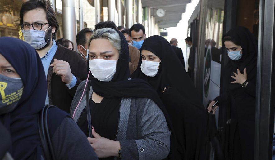 FILE - In this Oct. 11, 2020, file photo, people wear protective face masks to help prevent the spread of the coronavirus in downtown Tehran, Iran. Iran&#39;s campaign to inoculate its population against the coronavirus and promote itself as an emerging vaccine manufacturer inched on as health authorities announced Tuesday, March 16, 2021, that the country&#39;s third homegrown vaccine has reached the phase of clinical trials. (AP Photo/Ebrahim Noroozi, File)