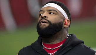FILE - San Francisco 49ers offensive tackle Trent Williams (71) looks on prior to an NFL football game against the Arizona Cardinals, in Glendale, Ariz., in this Saturday, Dec. 26, 2020, file photo.  The San Francisco 49ers locked up their biggest potential free agent for the long term by agreeing to give star left tackle Trent Williams the richest contract ever for an offensive lineman. Williams&#39; agents at Elite Loyalty Sports say the deal agreed to early Wednesday morning, March 17, 2021, will pay Williams $138.1 million over the next six years, surpassing the $138 million deal David Bakhtiari got from during last season. (AP Photo/Jennifer Stewart, File)
