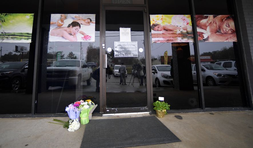 A makeshift memorial is seen outside a business where a multiple fatal shooting occurred on Tuesday in Acworth, Georgia. Robert Aaron Long, a white man, is accused of killing several people, most of whom were of Asian descent, at massage parlors in the Atlanta. (Associated Press)