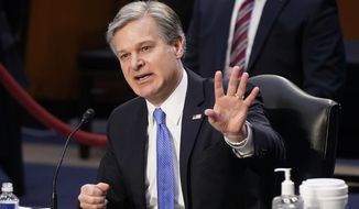 FBI Director Christopher Wray testifies before the Senate Judiciary Committee on Capitol Hill in Washington, Tuesday, March 2, 2021. Wray is condemning the Jan. 6 riot at the Capitol as “domestic terrorism.” (AP Photo/Patrick Semansky) **FILE**