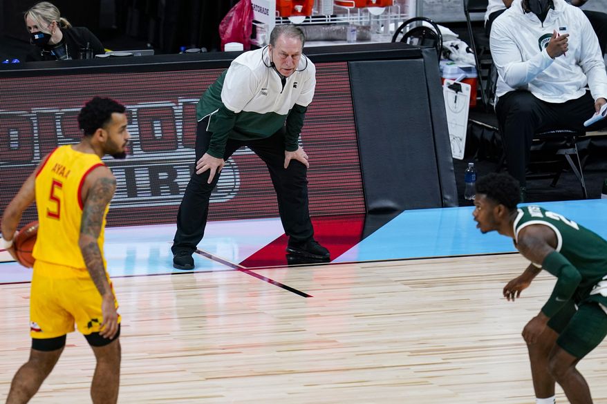 Michigan State head coach Tom Izzo watches from the bench as his team plays against Maryland in the first half of an NCAA college basketball game at the Big Ten Conference tournament in Indianapolis, Thursday, March 11, 2021. (AP Photo/Michael Conroy)