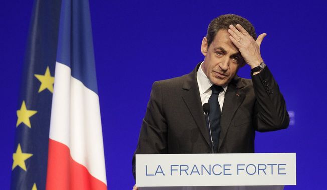 In this April 28, 2012, file photo, France&#x27;s President and candidate for reelection in 2012, Nicolas Sarkozy, gestures as he delivers a speech during a campaign meeting in Cournon-d&#x27;Auvergne, central France. Former President Sarkozy is scheduled to go on trial Wednesday, March 17, on charges that his unsuccessful reelection bid in 2012 was illegally financed.(AP Photo/Michel Euler, File)