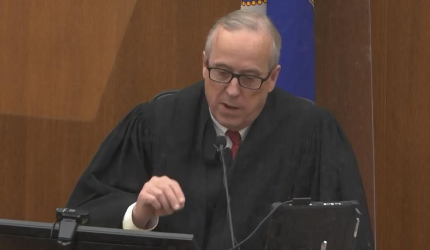 In this screen grab from video, Hennepin County Judge Peter Cahill presides over jury selection, Wednesday, March 17, 2021, in the trial of former Minneapolis police officer Derek Chauvin, in the May 25, 2020, death of George Floyd at the Hennepin County Courthouse in Minneapolis, Minn. The Judge dismissed a juror seated for ex-officer's trial who said $27M settlement to Floyd family would skew judgment. (Court TV, via AP, Pool)