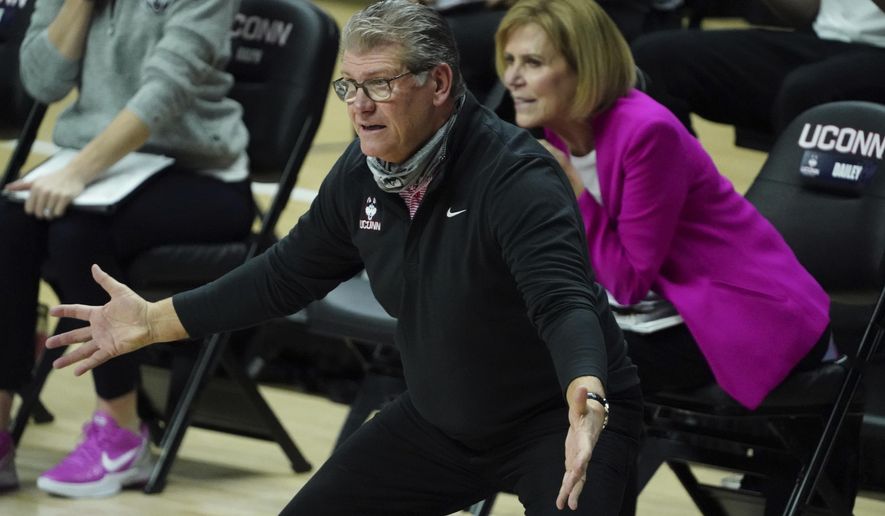 connecticut head coach Geno Auriemma watches from the sideline as the team takes on South Carolina in the first half of an NCAA college basketball game in Storrs, Conn., Monday, Feb. 8, 2021. (David Butler/Pool Photo via AP)