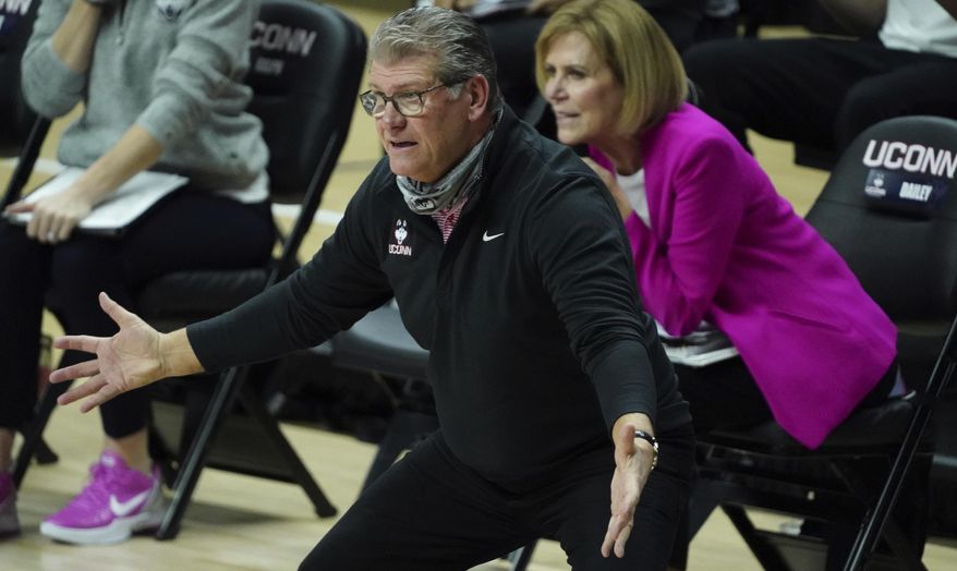 connecticut head coach Geno Auriemma watches from the sideline as the team takes on South Carolina in the first half of an NCAA college basketball game in Storrs, Conn., Monday, Feb. 8, 2021. (David Butler/Pool Photo via AP)
