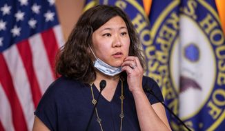 &quot;Your president and your party and your colleagues can talk about issues with any other country that you want, but you don&#x27;t have to do it by putting a bull&#x27;s-eye on the back of Asian Americans across this country,&quot; said Rep. Grace Meng, New York Democrat. (Associated Press photographs)