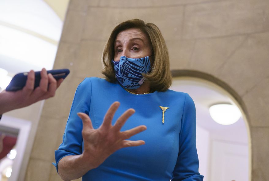 Speaker of the House Nancy Pelosi, D-Calif., prepares for votes in the House on the American Dream and Promise Act of 2021, a bill to help reform the immigration system. at the Capitol in Washington, Thursday, March 18, 2021. Pelosi paused for a reporter's question on the killings in Atlanta this week, where six of the eight victims were of Asian descent. (AP Photo/J. Scott Applewhite) **FILE**