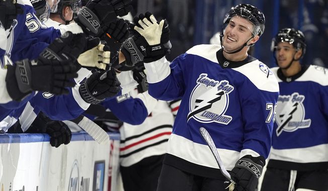 Tampa Bay Lightning left wing Ross Colton (79) celebrates with the bench after scoring against the Chicago Blackhawks during the third period of an NHL hockey game Thursday, March 18, 2021, in Tampa, Fla. (AP Photo/Chris O&#x27;Meara)