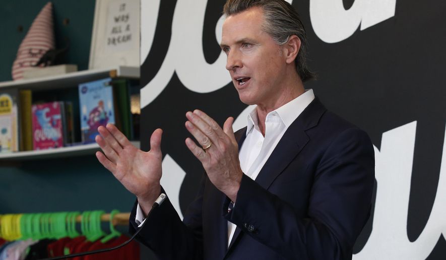 FILE - In this Tuesday, May 5, 2020, file photo California Gov. Gavin Newsom discusses his plan for the gradual reopening of California businesses during a news conference at the Display California store in Sacramento, Calif. Gov. Newsom said he could have communicated better with the public last year before the first loosening of coronavirus restrictions that led to an early summer spike in case, a moment the called a &amp;quot;gateway that we reflect upon all the time&amp;quot; as the nation&#39;s most populous state enters the second year of pandemic restrictions. (AP Photo/Rich Pedroncelli, Pool,File)