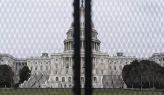 An inner perimeter anti-scaling fence is around the U.S. Capitol, Tuesday, March 16, 2021, in Washington. (AP Photo/Alex Brandon)
