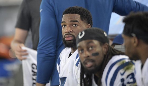 FILE - Indianapolis Colts quarterback Jacoby Brissett (7) and wide receiver T.Y. Hilton (13) watch from the bench during the second half of an NFL football game against the Jacksonville Jaguars in Jacksonville, Fla., in this Sunday, Dec. 29, 2019, file photo.By joining the Dolphins, Brissett embraced a No. 2 role behind Tua Tagovailoa, who is being groomed as a potential franchise quarterback — unless Houston&#39;s Deshaun Watson goes on the trade block, and Miami pursues him.Either way, Brissett will likely be on the bench at age 28. (AP Photo/Phelan M. Ebenhack, File)