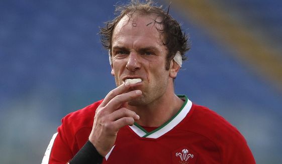 Wales&#39;Alun Wyn Jones takes out is mouthguard during the Six Nations rugby union match between Italy and Wales, in the Olympic stadium in Rome, Italy, Saturday, March 13, 2021. (AP Photo/Alessandra Tarantino)
