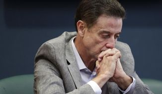 FILE - In this June 15, 2017, file photo, Louisville basketball coach Rick Pitino listens during an NCAA college basketball news conference in Louisville, Ky. Rick Pitino survived sex scandals and FBI investigations , won national championships , and when his coaching options seemingly dried up , he left for Greece. Somehow , the winding road of his career took him to Iona - and back in the NCAA Tournament. The last stop - he swears it’s true - of his career. (Alton Strupp/The Courier-Journal via AP, File)