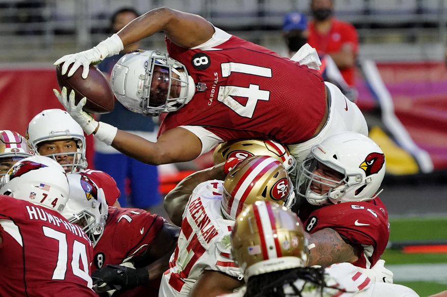 FILE - Arizona Cardinals running back Kenyan Drake (41) dives over the line for a touchdown against the San Francisco 49ers during the second half of an NFL football game in Glendale, Ariz., in this Saturday, Dec. 26, 2020, file photo. The Las Vegas Raiders have agreed to a two-year deal worth up to $14.5 million with free agent running back Kenyan Drake to complement starter Josh Jacobs. A person familiar with the deal says Drake will be guaranteed $11 million under the deal agreed to on Thursday, March 18, 2021. The person spoke on condition of anonymity because the deal hasn't been announced. (AP Photo/Rick Scuteri, File)