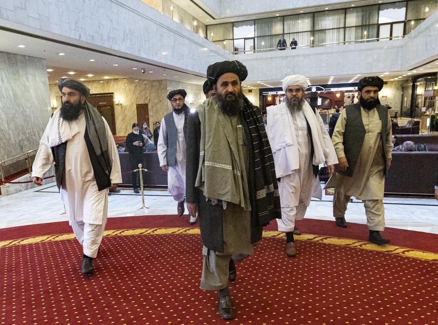 Taliban co-founder Mullah Abdul Ghani Baradar, center, arrives with other members of the Taliban delegation for an international peace conference in Moscow, Russia, Thursday, March 18, 2021. Russia is hosting a peace conference for Afghanistan, bringing together government representatives and their Taliban adversaries along with regional observers in a bid to help jump-start the country&#39;s stalled peace process. The one-day gathering Thursday is the first of three planned international conferences ahead of a May 1 deadline for the final withdrawal of U.S. and NATO troops from the country, a date fixed under a year-old agreement between the Trump administration and the Taliban. (AP Photo/Alexander Zemlianichenko, Pool) **FILE**