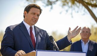 Florida Gov. Ron DeSantis speaks to the media as he visited the drive-thru COVID-19 vaccination site at On Top of the World in Ocala, Fla., on Friday, March 5, 2021.  (Alan Youngblood/Ocala Star-Banner via AP) **FILE**
