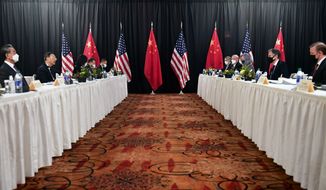 FIEL - In this March 18, 2021, file photo, Secretary of State Antony Blinken, second from right, joined by national security adviser Jake Sullivan, right, speaks while facing Chinese Communist Party foreign affairs chief Yang Jiechi, second from left, and China&#39;s State Councilor Wang Yi, left, at the opening session of U.S.-China talks at the Captain Cook Hotel in Anchorage, Alaska. China said Friday, March 19, 2021, a strong smell of gunpowder and drama resulted from talks with top American diplomats in Alaska, continuing the contentious tone of the first face-to-face meetings under the Biden administration. (Frederic J. Brown/Pool Photo via AP, File)