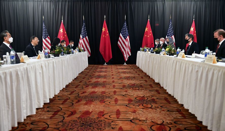FIEL - In this March 18, 2021, file photo, Secretary of State Antony Blinken, second from right, joined by national security adviser Jake Sullivan, right, speaks while facing Chinese Communist Party foreign affairs chief Yang Jiechi, second from left, and China&#x27;s State Councilor Wang Yi, left, at the opening session of U.S.-China talks at the Captain Cook Hotel in Anchorage, Alaska. China said Friday, March 19, 2021, a strong smell of gunpowder and drama resulted from talks with top American diplomats in Alaska, continuing the contentious tone of the first face-to-face meetings under the Biden administration. (Frederic J. Brown/Pool Photo via AP, File)
