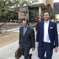 FILE - In this Nov. 5, 2019, file photo, then-Maricopa County Assessor Paul Petersen, right, and his attorney, Kurt Altman, leave a court hearing in Phoenix. Petersen, a former Phoenix politician already in prison on a six-year sentence for operating an illegal adoption scheme involving women from the Marshall Islands, was ordered Friday, March 19, 2021, to serve another five years behind bars for defrauding Arizona’s Medicaid system in a scam to get taxpayer-funded health coverage for the birth mothers, even though he knew they didn’t live in the state. (AP Photo/Jacques Billeaud, File)