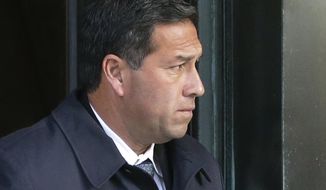 FILE - In this March 25, 2019, file photo Jorge Salcedo, former University of California at Los Angeles men&#x27;s soccer coach, departs federal court in Boston after facing charges in a nationwide college admissions bribery scandal. Salcedo pleaded guilty in April 2020, and was sentenced to eight months behind bars Friday, March 19, 2021, for pocketing $200,000 in bribes to help applicants get into the school as bogus athletic recruits. (AP Photo/Steven Senne, File)