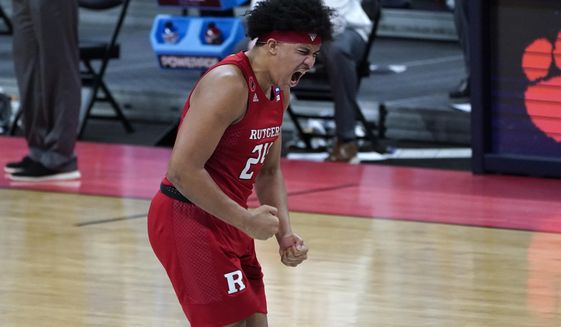 Rutgers guard Ron Harper Jr. (24) celebrates beating Clemson 60-56 after a men&#39;s college basketball game in the first round of the NCAA tournament at Bankers Life Fieldhouse in Indianapolis, Friday, March 19, 2021. (AP Photo/Paul Sancya)