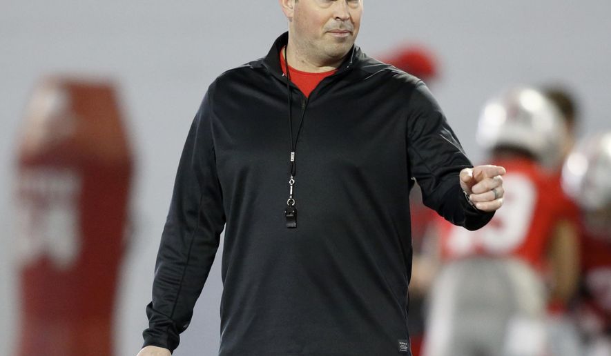 FILE - In this March 6, 2019, file photo, Ohio State University football coach Ryan Day gestures during an NCAA college football practice in Columbus, Ohio. Ohio State on Friday, March 19, 2021, opened what Day hopes will be an uninterrupted spring practice as he seeks a new starting quarterback and some normalcy after a tumultuous 2020. (AP Photo/Paul Vernon, File)