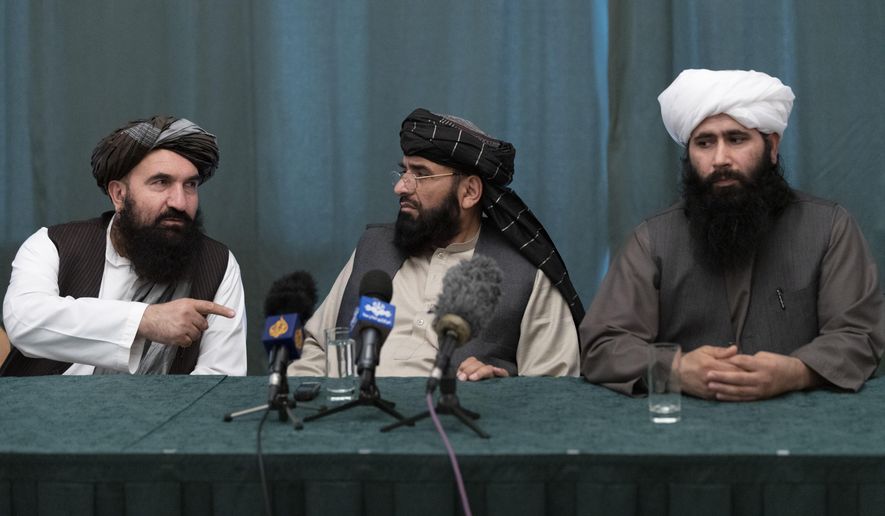 Members of the Taliban delegation from the left: Khairullah Khairkhwa, former western Herat Governor and one of five Taliban released from the U.S. prison on Guantanamo Bay in exchange for U.S. soldier Bowe Bergdahl, Suhail Shaheen, member of negotiation team, Mohammad Naeem, spokesman for the Taliban&#39;s political office attend their joint news conference in Moscow, Russia, Friday, March 19, 2021. The Taliban warned Washington against defying a May 1 deadline for the withdrawal of American and NATO troops from Afghanistan promising a &amp;quot;reaction&amp;quot;. (AP Photo/Alexander Zemlianichenko, Pool)
