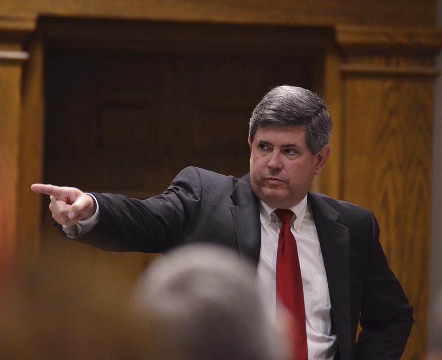 FILE - In this March 16, 2014 file photo, Solicitor Barry Barnette points out Ricky Lee Blackwell, Sr. during closing arguments in the sentencing phase of Blackwell's trial at the Spartanburg County Courthouse in Spartanburg, S.C. South Carolina’s attorney general has sent four unresolved Statehouse corruption cases to a Republican prosecutor in Spartanburg County to handle. (Tim Kimzey/Spartanburg Herald-Journal via AP)