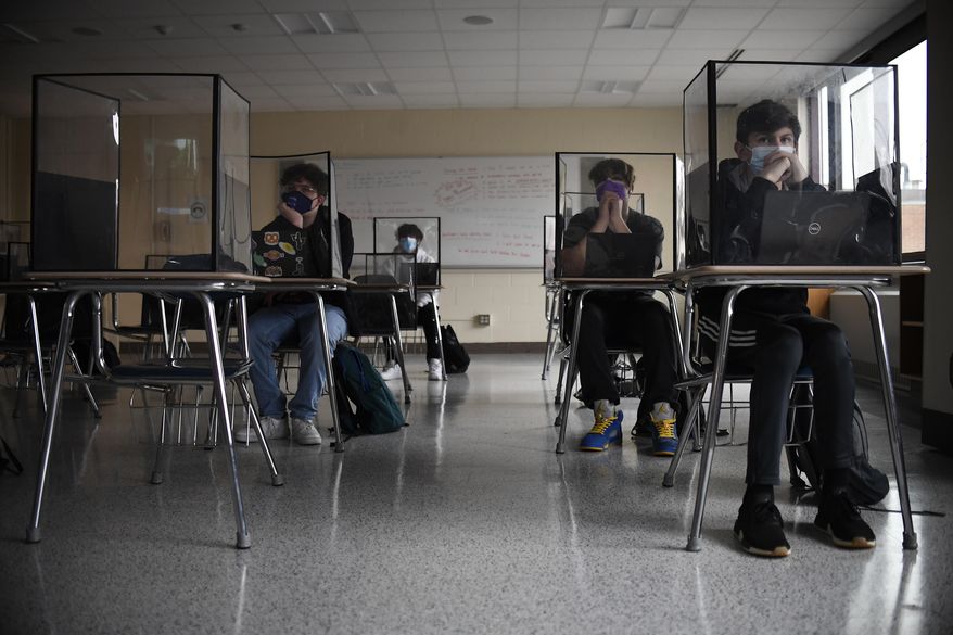 In this March 18, 2021, file photo, students listen to a presentation in a health class in a Connecticut high school. (AP Photo/Jessica Hill, File) **FILE**