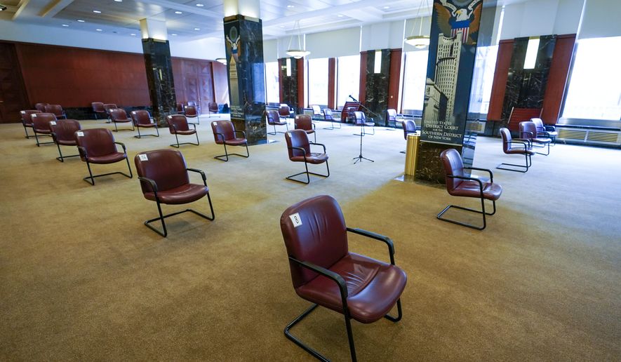 Amid the coronavirus pandemic, chairs are spaced for proper social distancing inside the jury room at a Manhattan federal courthouse, Friday, March 12, 2021, in New York. (AP Photo/Mary Altaffer)