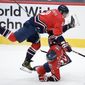 Washington Capitals left wing Alex Ovechkin (8) collides with center Evgeny Kuznetsov (92) during the third period of the team&#39;s NHL hockey game against the New York Rangers, Saturday, March 20, 2021, in Washington. The Rangers won 3-1. (AP Photo/Nick Wass)