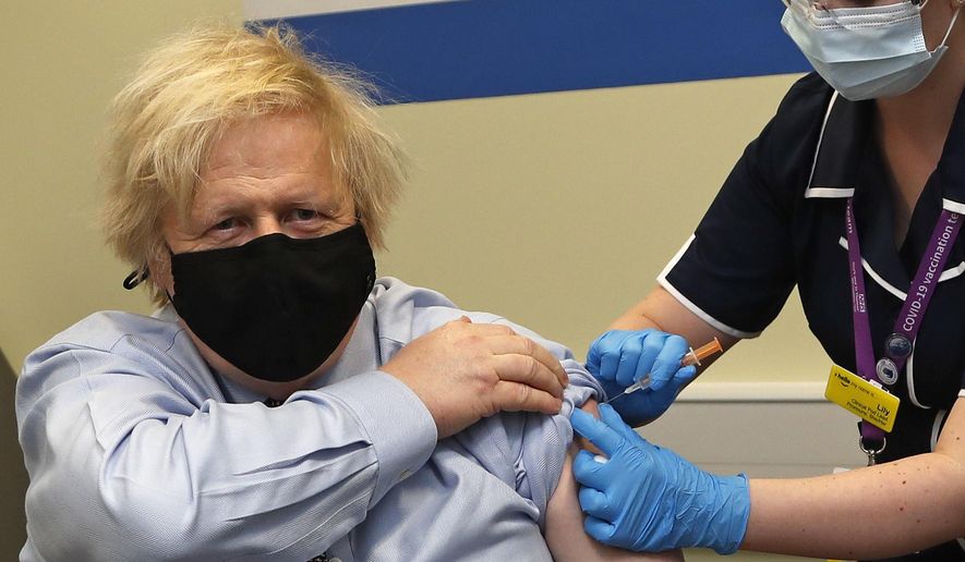 Britain&#39;s Prime Minister Boris Johnson receives the first dose of the AstraZeneca vaccine administered by nurse and Clinical Pod Lead, Lily Harrington at St. Thomas&#39; Hospital in London, Friday, March 19, 2021. Johnson is one of several politicians across Europe, including French Prime Minister Jean Castex, getting a shot of the AstraZeneca vaccine on Friday. (AP Photo/Frank Augstein, Pool)