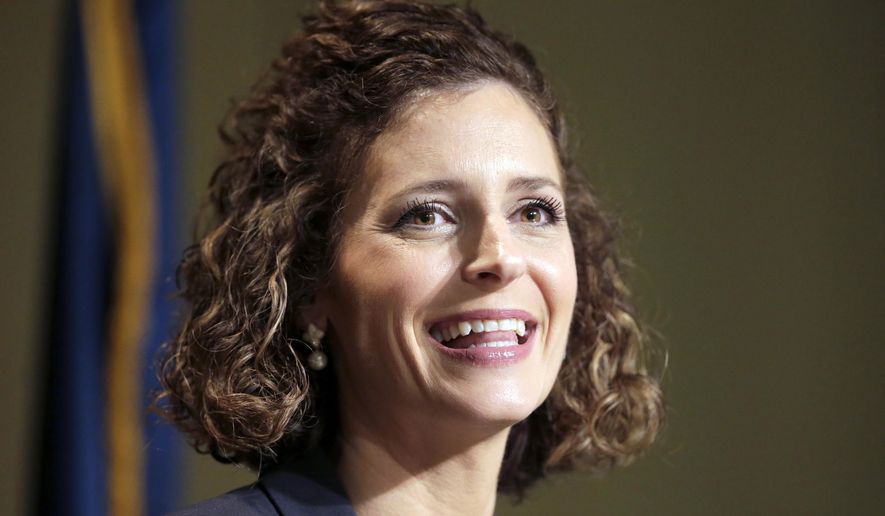FILE - In this Jan. 21, 2021, file photo, Julia Letlow, widow of Republican U.S. Rep.-elect Luke Letlow, speaks to reporters in Baton Rouge, La., after signing up to run for the 5th District seat. Three months after Louisiana voters determined the state's congressional lineup, the presidential election and the coronavirus pandemic are forcing a new round of elections Saturday for two of those U.S. House seats. Julia Letlow is the front-runner among 12 candidates in the race, with the backing of Donald Trump and the state GOP in a deep red district and more money raised than all her competitors combined. (AP Photo/Brett Duke, File)