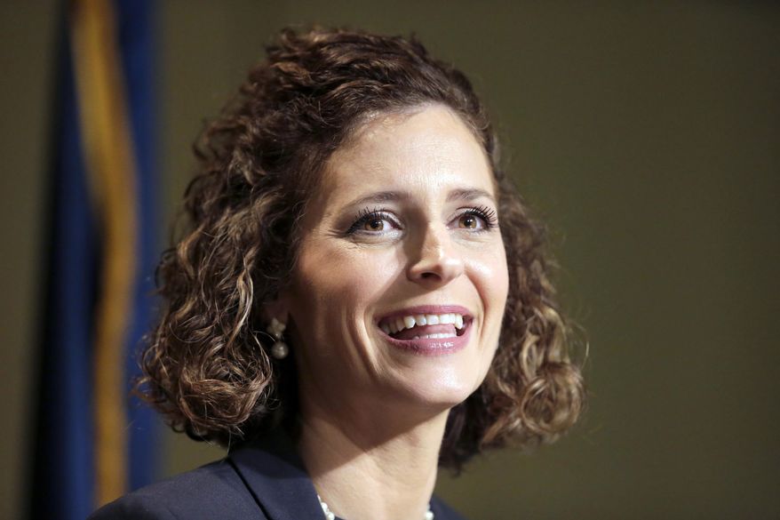 FILE - In this Jan. 21, 2021, file photo, Julia Letlow, widow of Republican U.S. Rep.-elect Luke Letlow, speaks to reporters in Baton Rouge, La., after signing up to run for the 5th District seat. Three months after Louisiana voters determined the state's congressional lineup, the presidential election and the coronavirus pandemic are forcing a new round of elections Saturday for two of those U.S. House seats. Julia Letlow is the front-runner among 12 candidates in the race, with the backing of Donald Trump and the state GOP in a deep red district and more money raised than all her competitors combined. (AP Photo/Brett Duke, File)