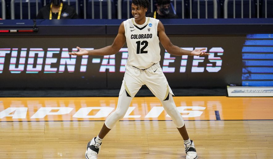 Colorado forward Jabari Walker (12) celebrates a three-point basket against Georgetown in the first half of a first-round game in the NCAA men&#39;s college basketball tournament at Hinkle Fieldhouse in Indianapolis, Saturday, March 20, 2021. (AP Photo/Michael Conroy)