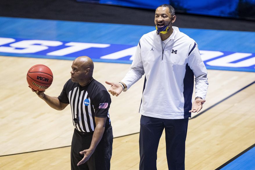 Michigan head coach Juwan Howard questions a call during the second half of a first-round game against Texas Southern in the NCAA men's college basketball tournament, Saturday, March 20, 2021, at Mackey Arena in West Lafayette, Ind. (AP Photo/Robert Franklin)