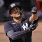 New York Yankees&#39; Giancarlo Stanton adjusts his elbow pad during an at-bat in the fifth inning of a spring training exhibition baseball game against the Detroit Tigers at George M. Steinbrenner Field in Tampa, Fla., Friday, March 5, 2021. (AP Photo/Gene J. Puskar)