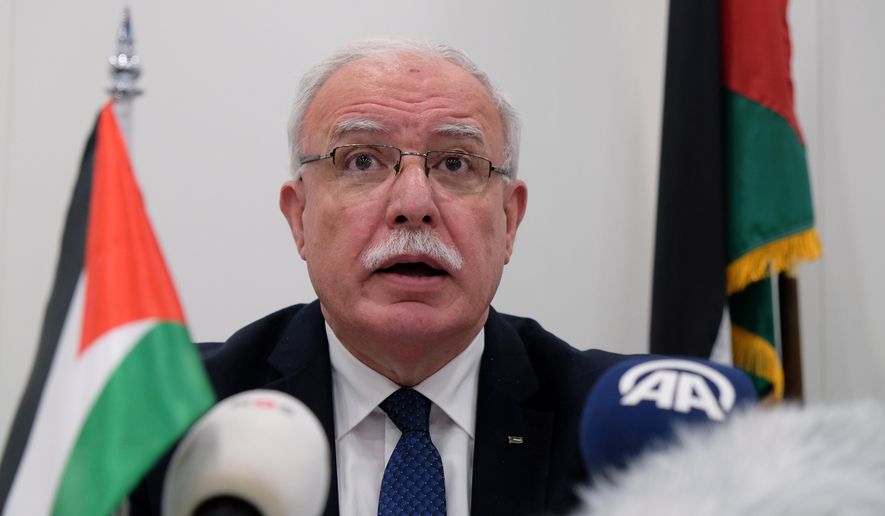 FILE - In this May 22, 2018 file photo, Palestinian Foreign Minister Riad Malki speaks during a press conference at the International Criminal Court. Israel on Sunday, March 21, 2021 revoked the VIP permit of Malki after he returned to the West Bank from a trip to the International Criminal Court in the Hague, Israeli and Palestinian officials confirmed. (AP Photo/Mike Corder)